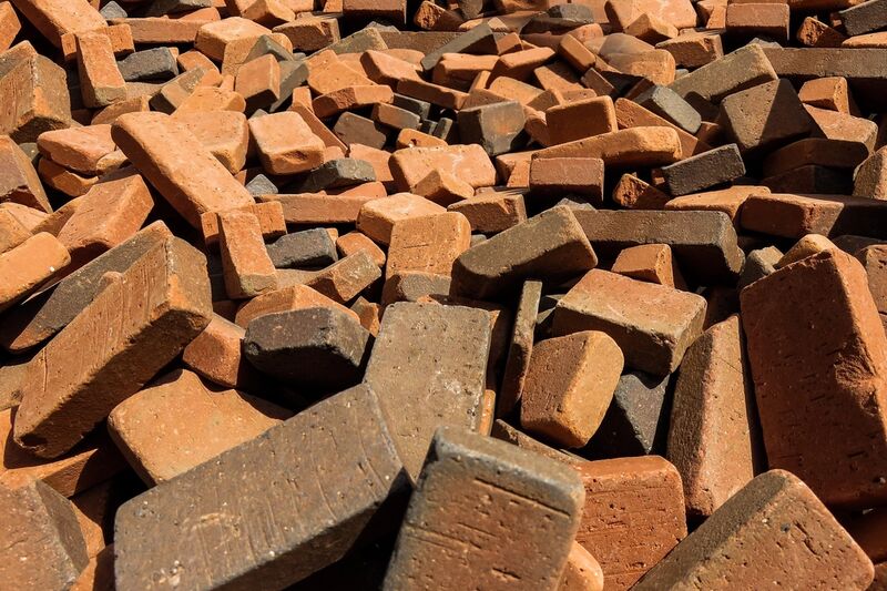 Chunks of broken brick with mortar still attached, piled up hard fill